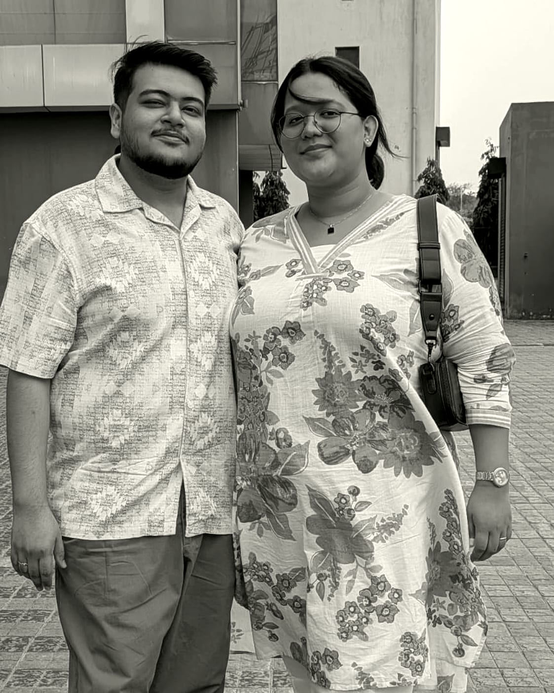 Rachel and Praduan standing together outdoors in daylight